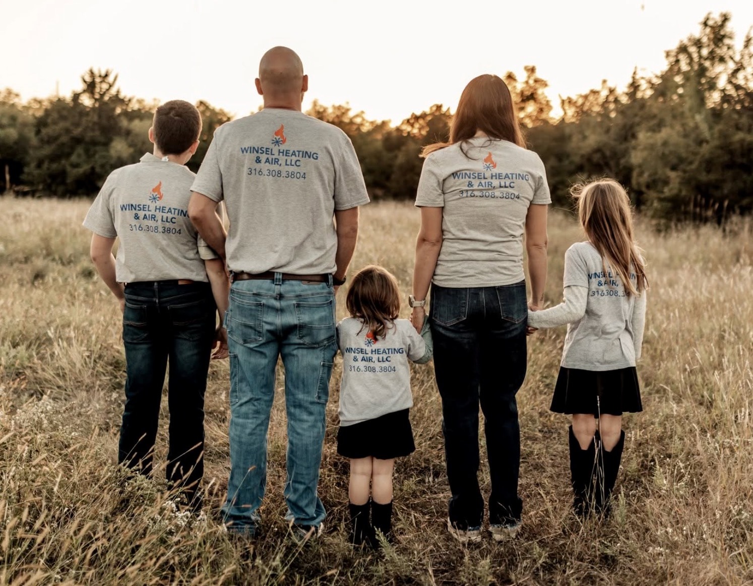 The Winsel family together in their company shirts
